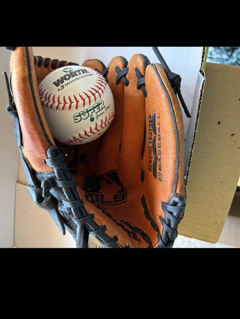 Wilson Baseball Glove w/New White Baseball-NEVER USED. HAS FLAKING FROM GARAGE.